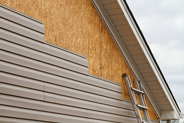 Professional Storm Damage Siding Repair technician working in Rosemount, OH